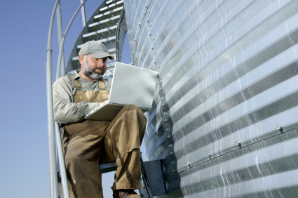 Farmer working on laptop